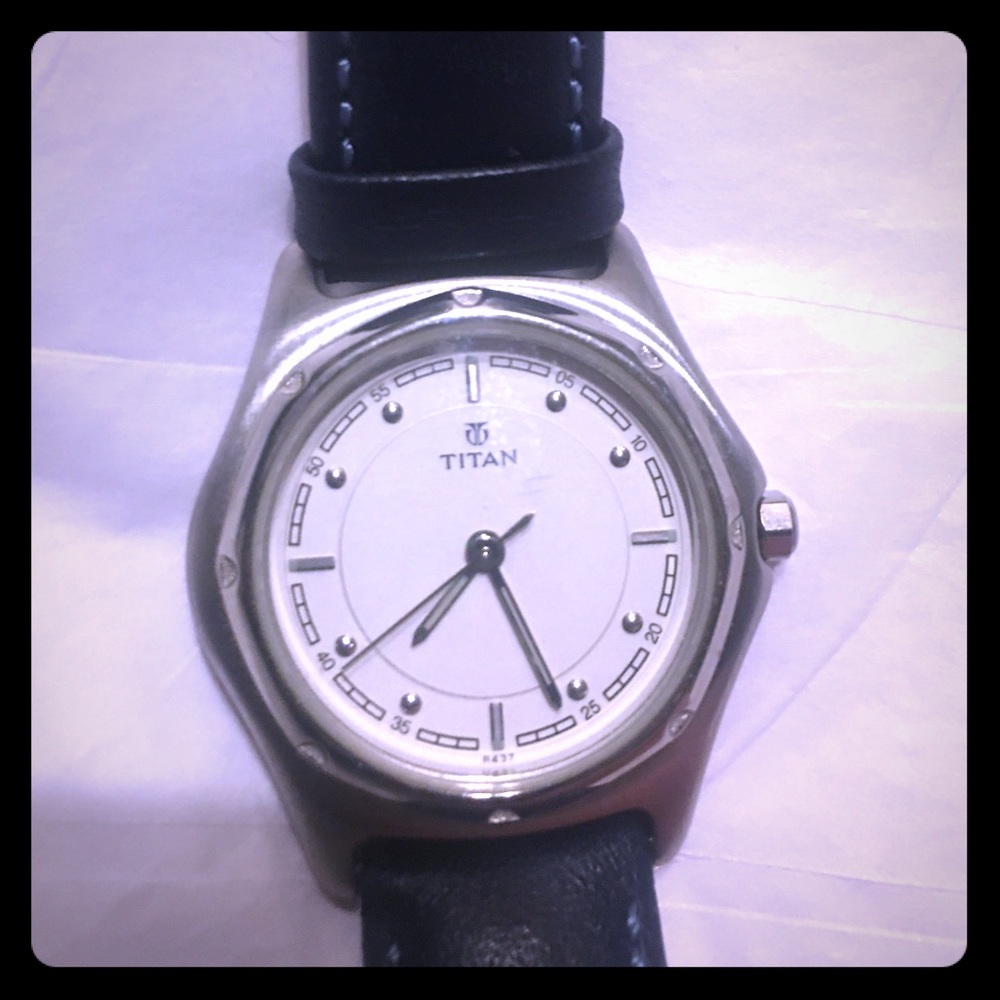 Titan women’s round faced stainless steel watch